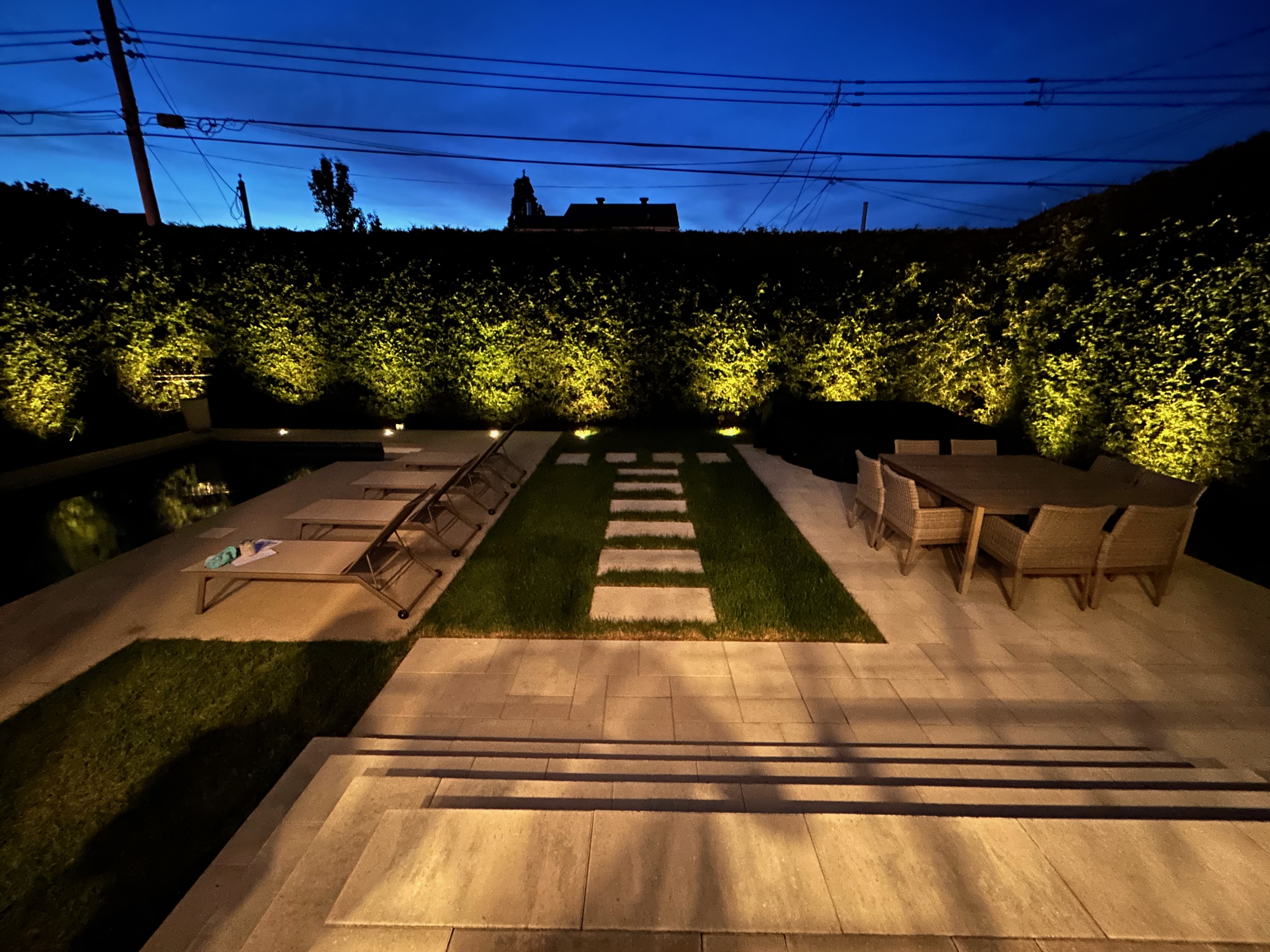 Beautiful backyard makeover with landscape lighting in Laval, Qc.